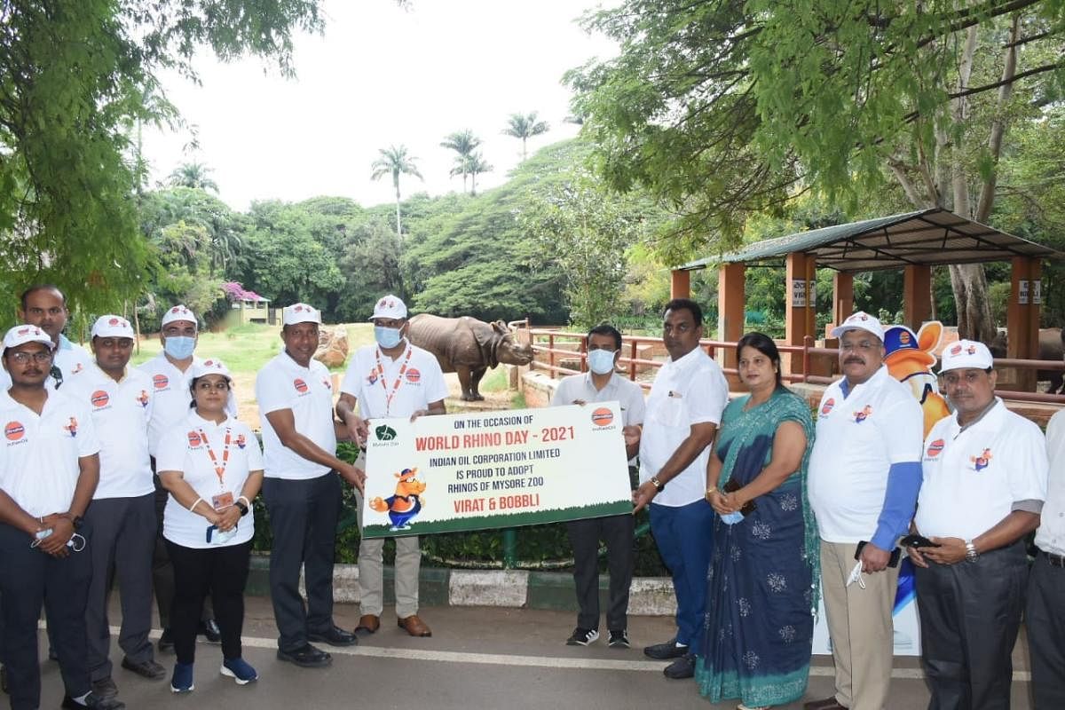 Indian Oil Corporation Limited officials receive the adoption certificate of the rhinoceros from Chairman of Zoo Authority of Karnataka L R Mahadevaswamy at Sri Chamarajendra Zoological Gardens in Mysuru on Wednesday. Credit: DH Photo