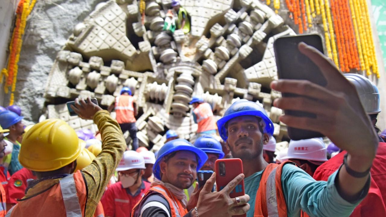 BMRCL workers celebrate the breakthrough at Shivajinagar on Wednesday. Credit: DH Photo/Pushkar V