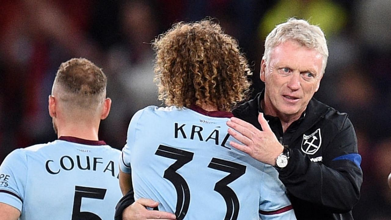 West Ham United's Czech midfielder Alex Kral and West Ham United's Scottish manager David Moyes celebrate after the English League Cup third round football match between Manchester United and West Ham United at Old Trafford in Manchester. Credit: AFP Photo