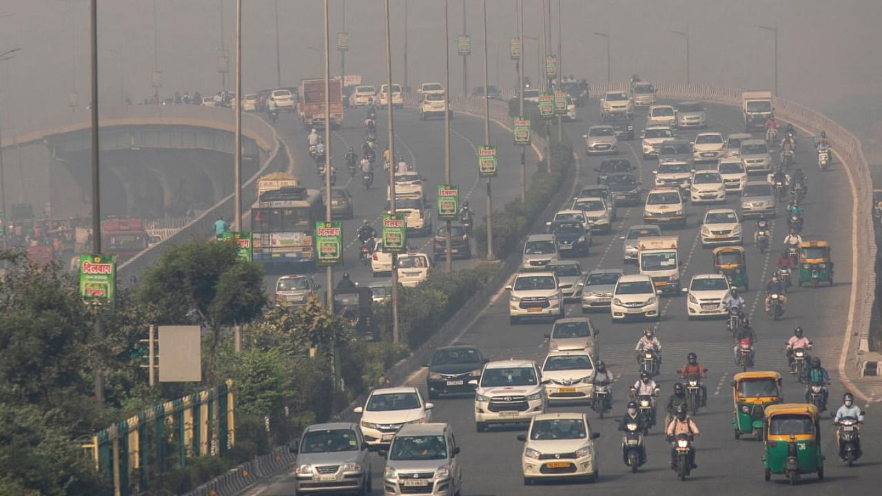 Traffic moves on a smoggy morning in New Delhi. Credit: Reuters Photo