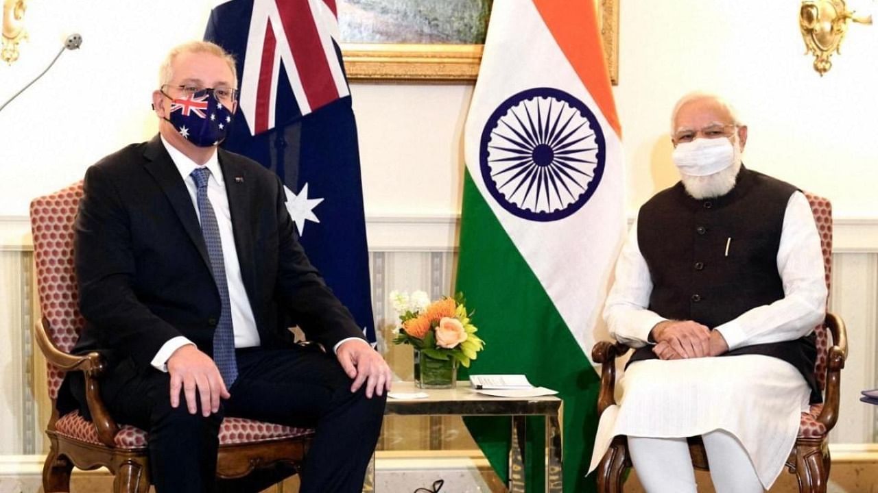 Prime Minister Narendra Modi with Australian PM Scott Morrison during a meeting. Credit: PTI Photo/Twitter/@PMOIndia