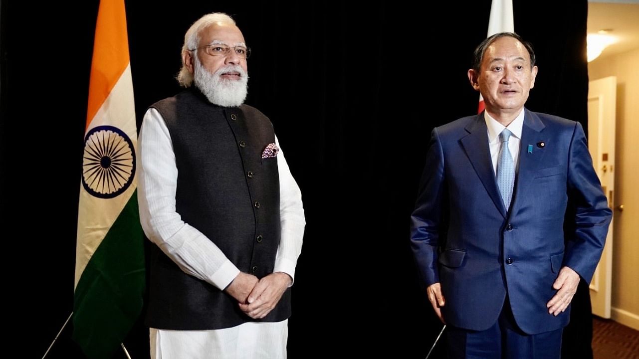 PM Narendra Modi (left) with Japanese PM Yoshihide Suga. Credit: Twitter/@PMOIndia