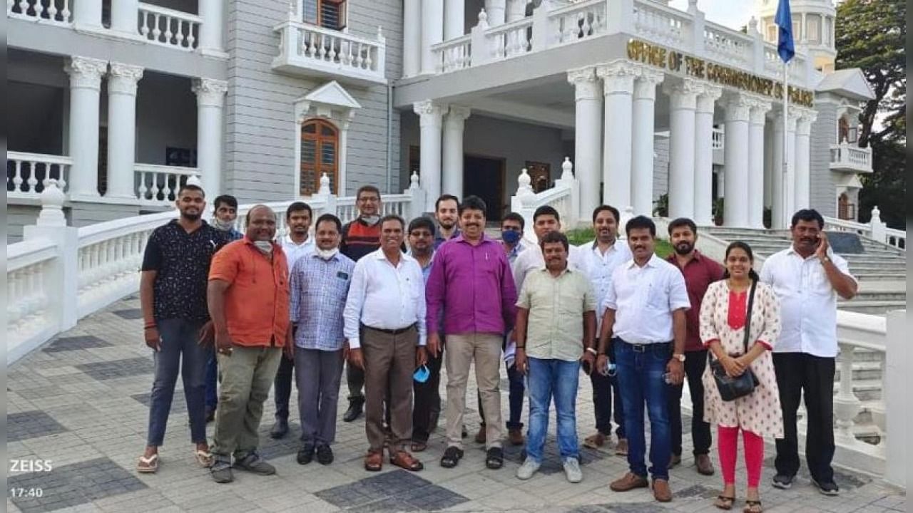 Hoteliers and traders come out of the police commissioner's office after meeting commissioner Chandragupta in Mysuru on Thursday. Credit: DH Photo