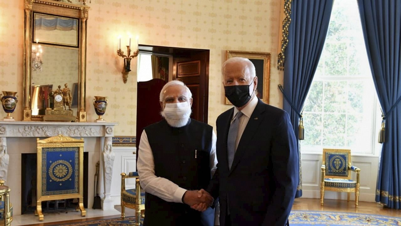 Narendra Modi  (L) and Joe Biden. Credit: PTI Photo