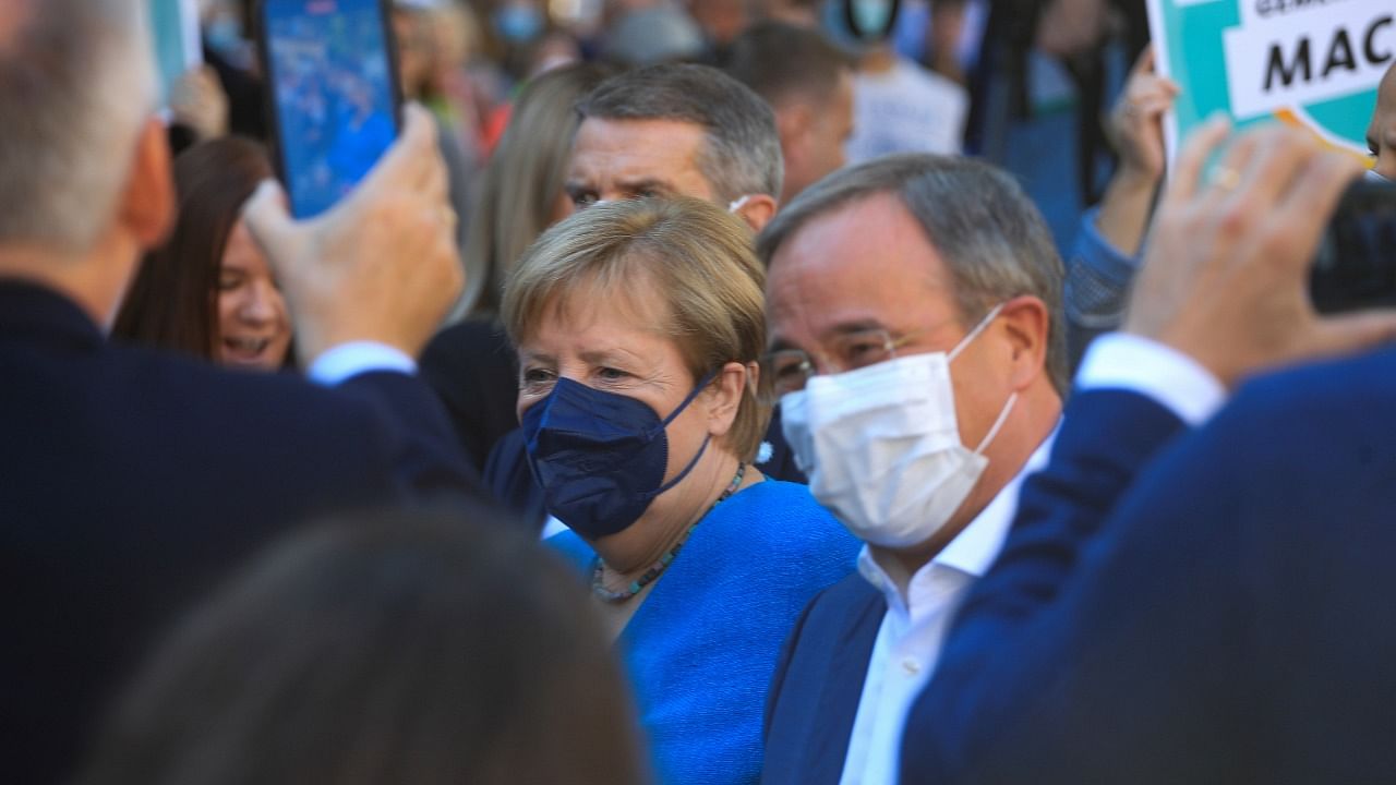 German Chancellor Merkel and CDU party leader and candidate for chancellor Laschet attend a rally, in Aachen. Credit: Reuters Photo