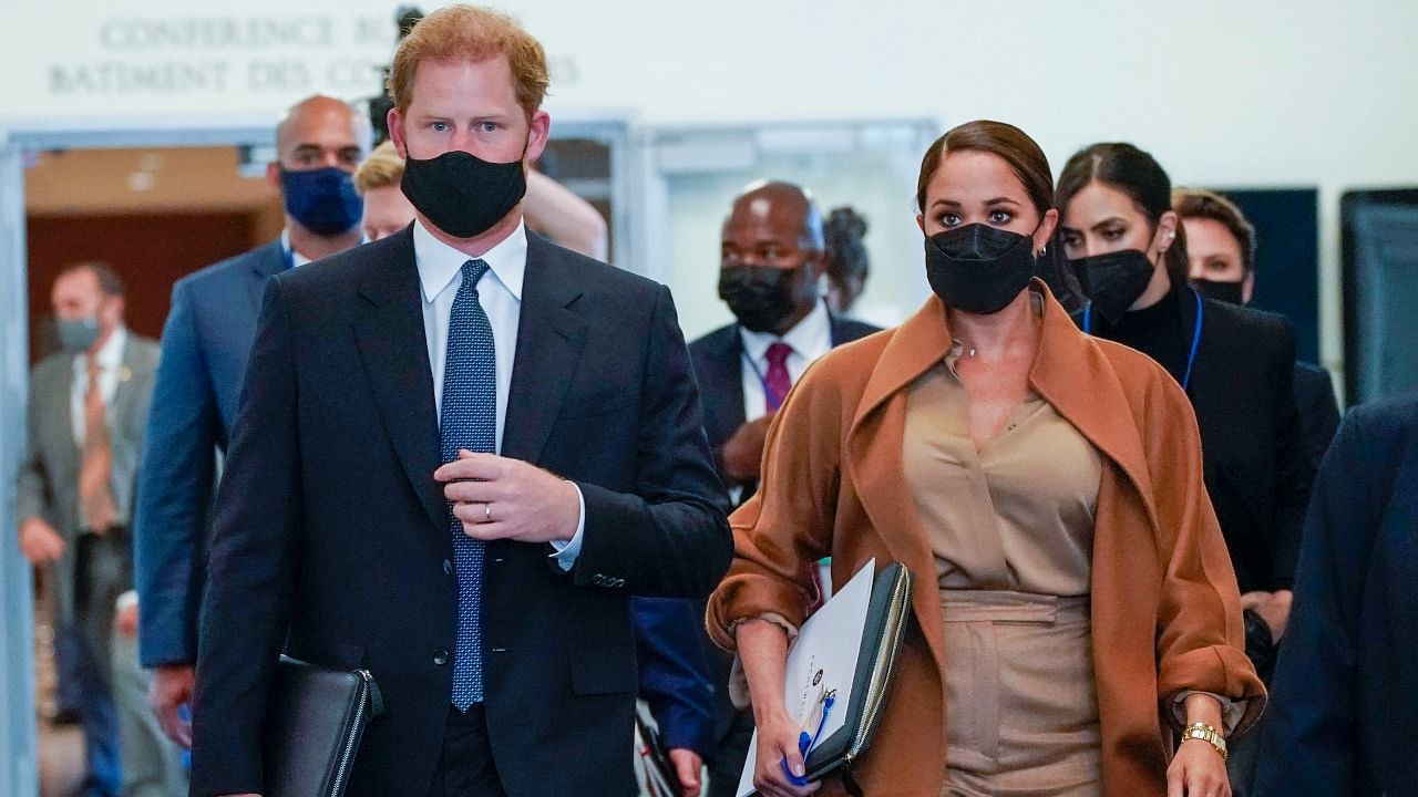 Prince Harry and Meghan, the Duke and Duchess of Sussex are escorted as they leave the United Nations headquarters after a visit during 76th session of the United Nations General Assembly. Credit: AP Photo