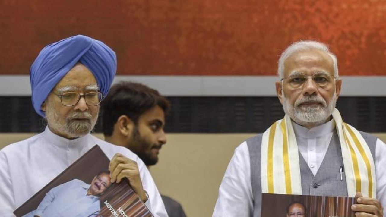 Prime Minister Narendra Modi and former Prime Minister Manmohan Singh. Credit: PTI File Photo
