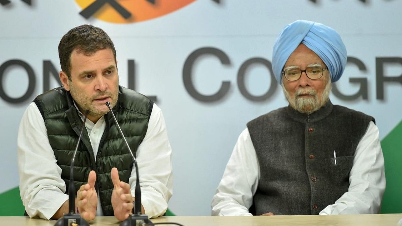Rahul Gandhi (L) and Manmohan Singh (R). Credit: PTI File Photo