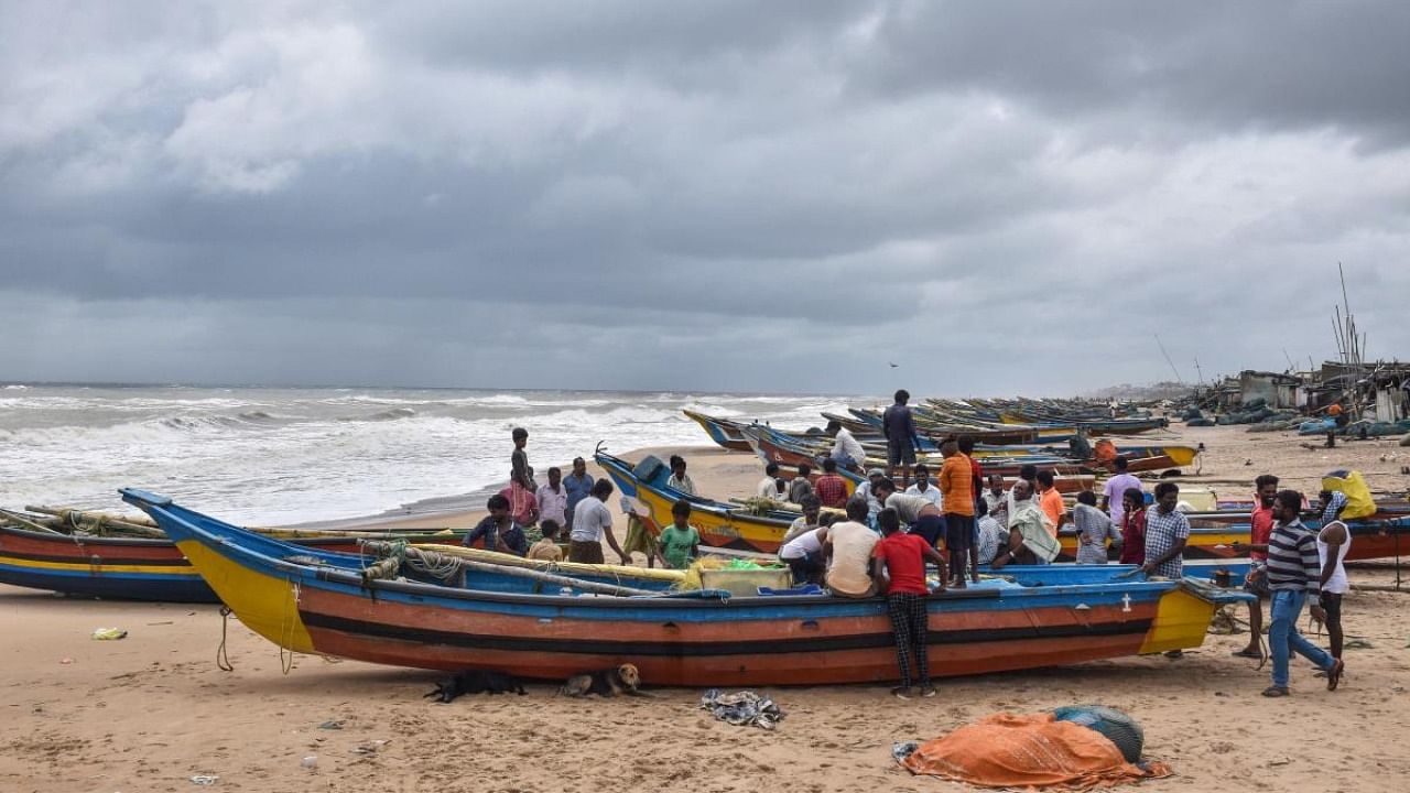 Fishermen park their boats on the Puri beach as IMD has restricted venturing in the sea due to Cyclone Gulab. Credit: PTI photo