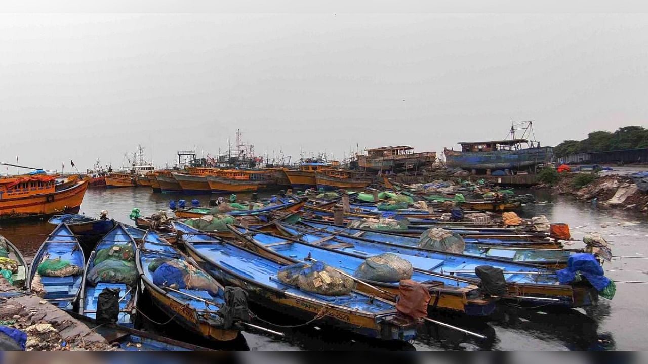Boats being parked on the fish harbour as Indian Meteorological Department has restricted venturing in the sea due to cyclone Gulab in Visakhapatnam. Credit: PTI Photo