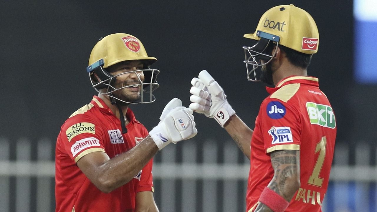 Mayank Agarwal of Punjab Kings and KL Rahul captain of Punjab Kings during match 37 of the Indian Premier League between the Sunrisers Hyderabad and Punjab Kings, at the Sharjah Cricket Stadium, Sharjah in the United Arab Emirates, Saturday. Credit: PTI Photo