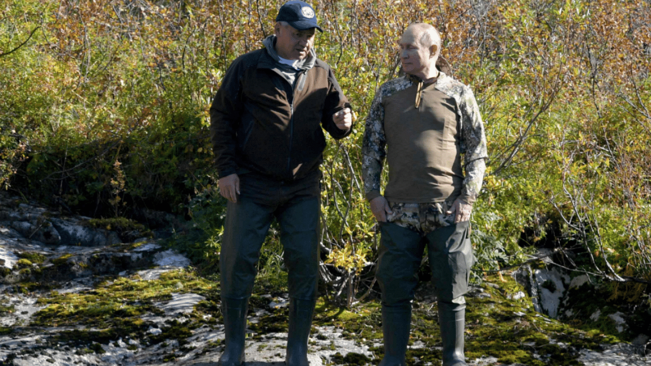 Russian President Vladimir Putin (R) speaks with Russian Defence Minister Sergei Shoigu in the taiga. Credit: AFP Photo