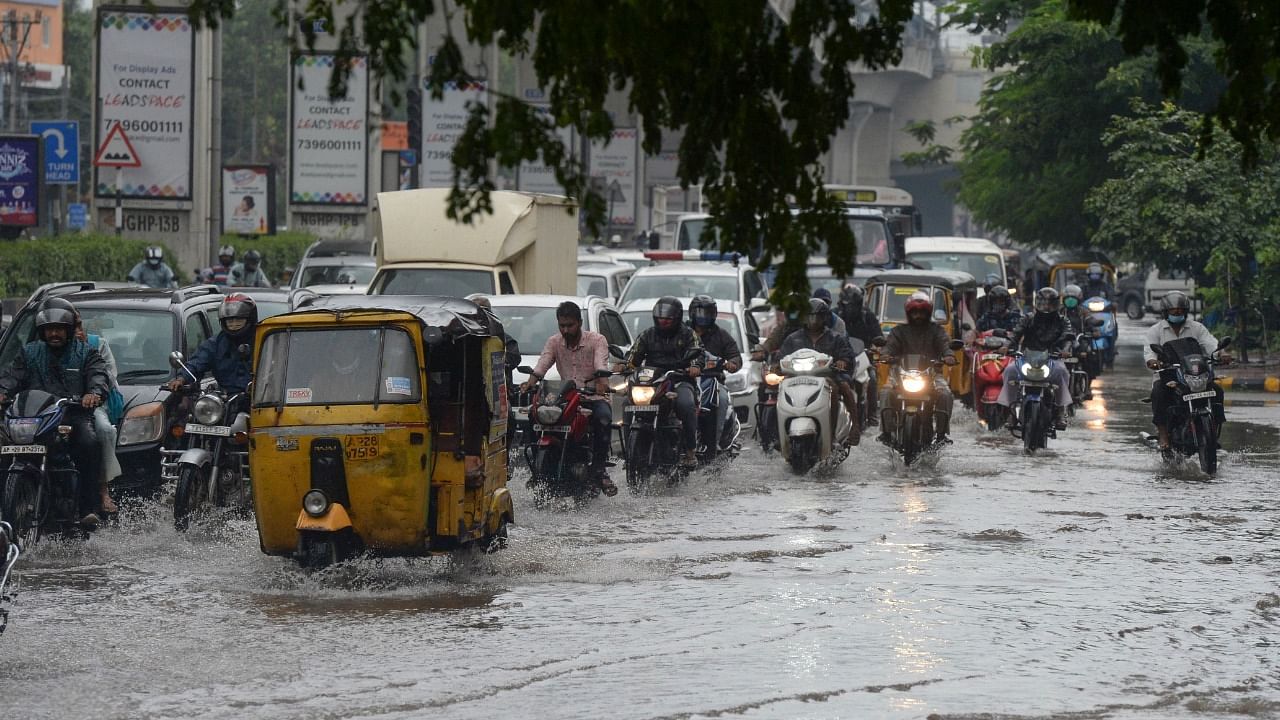 Motorists make their way through a water-logged street amid heavy rains in Hyderabad on September 27, 2021, the morning after cyclone Gulab made landfall between the coastal Indian states of Odisha and Andhra Pradesh. Credit: AFP Photo