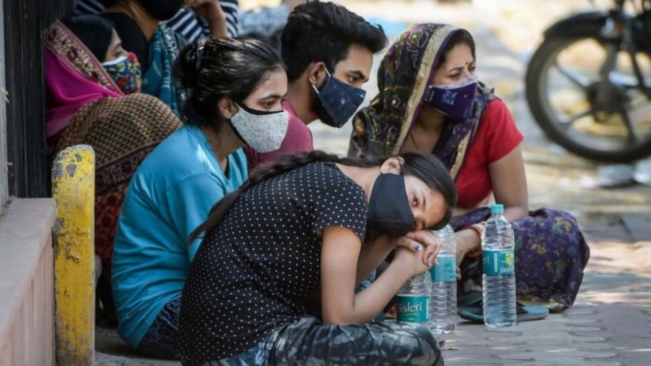 Relatives mourns after the death of family member due to Covid-19, as coronavirus cases surge in the national capital , at LNJP Hospital ,in New Delhi, Sunday, May 9, 2021. Credit: PTI File Photo