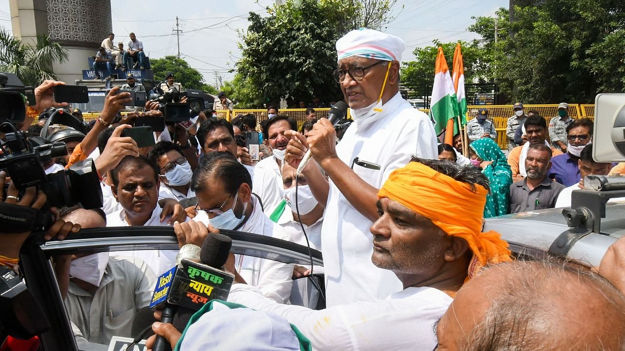 Congress senior leader Digvijaya Singh participates in farmers protest during 'Bharat Bandh' against the Central government's farm reform laws at Karond Mandi in Bhopal. Credit: PTI Photo