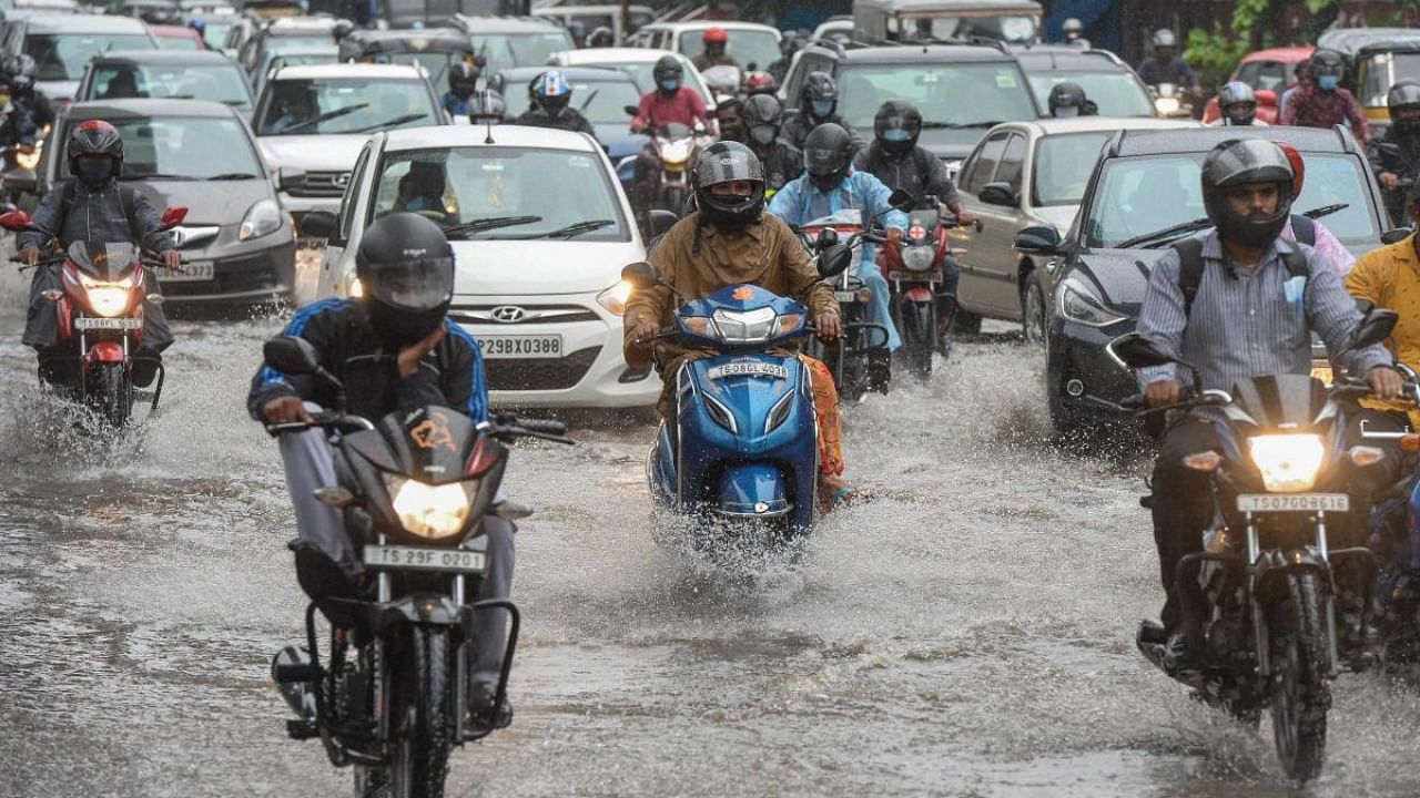 Motorists make their way through a water-logged street amid heavy rains in Hyderabad on September 27, 2021, the morning after cyclone Gulab made landfall between the coastal Indian states of Odisha and Andhra Pradesh. Credit: AFP Photo