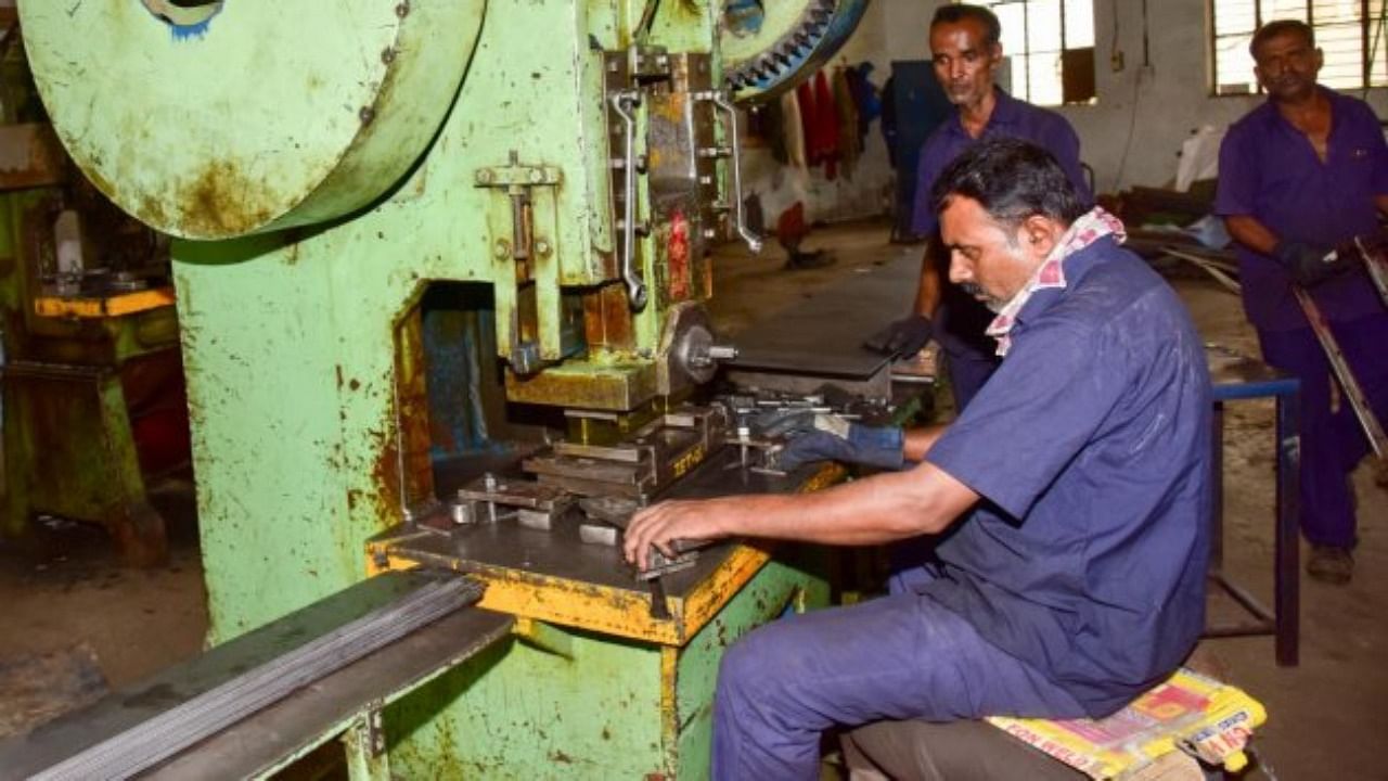 Workers at a factory in Peenya. Credit: DH File Photo