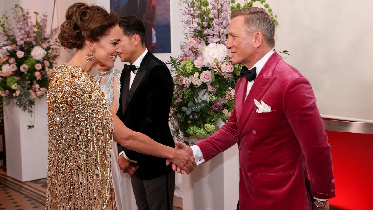 Britain's Catherine, Duchess of Cambridge (L) talks to English actor Daniel Craig ahead of the World Premiere of the James Bond 007 film "No Time to Die" at the Royal Albert Hall in west London on September 28, 2021. Credit: AFP Photo