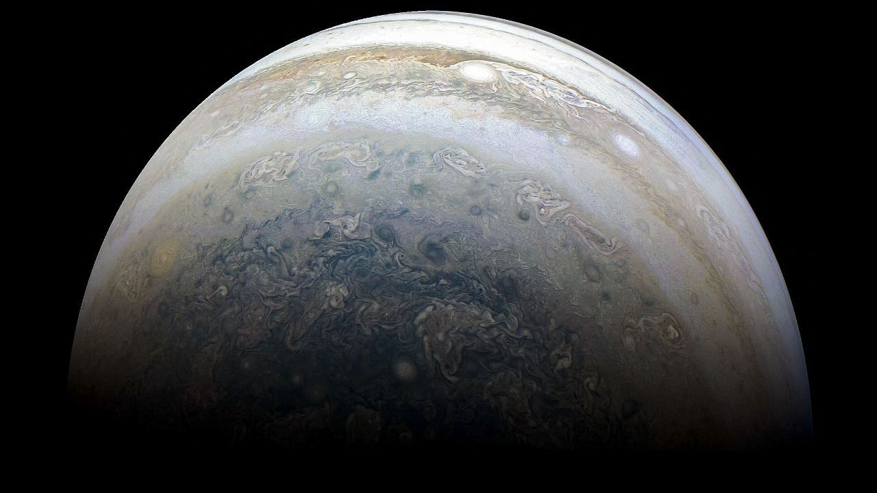  This file NASA photo released on July 2, 2018 shows Jupiter's southern hemisphere captured by NASA's Juno spacecraft on the outbound leg of a close flyby of the gas-giant planet.