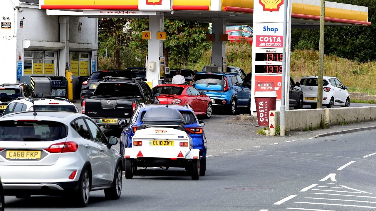 Cars queue up at a petrol and diesel filling station, Begelly, Pembrokeshire, Wales, Britain. Credit: Reuters Photo