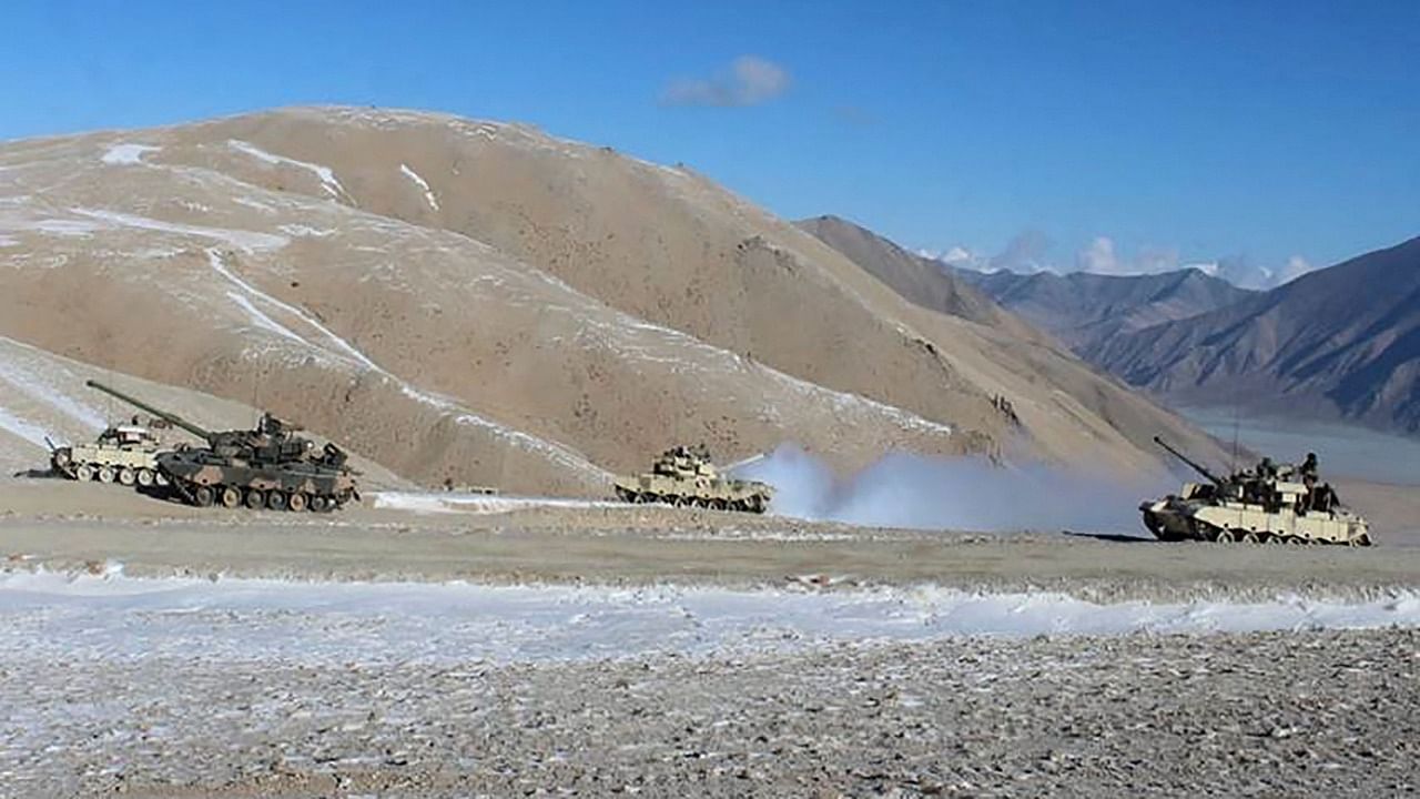 In this undated handout photograph released by the Indian Army on February 16, 2021 shows People Liberation Army (PLA) soldiers and tanks during military disengagement along the Line of Actual Control (LAC). Credit: AFP Photo