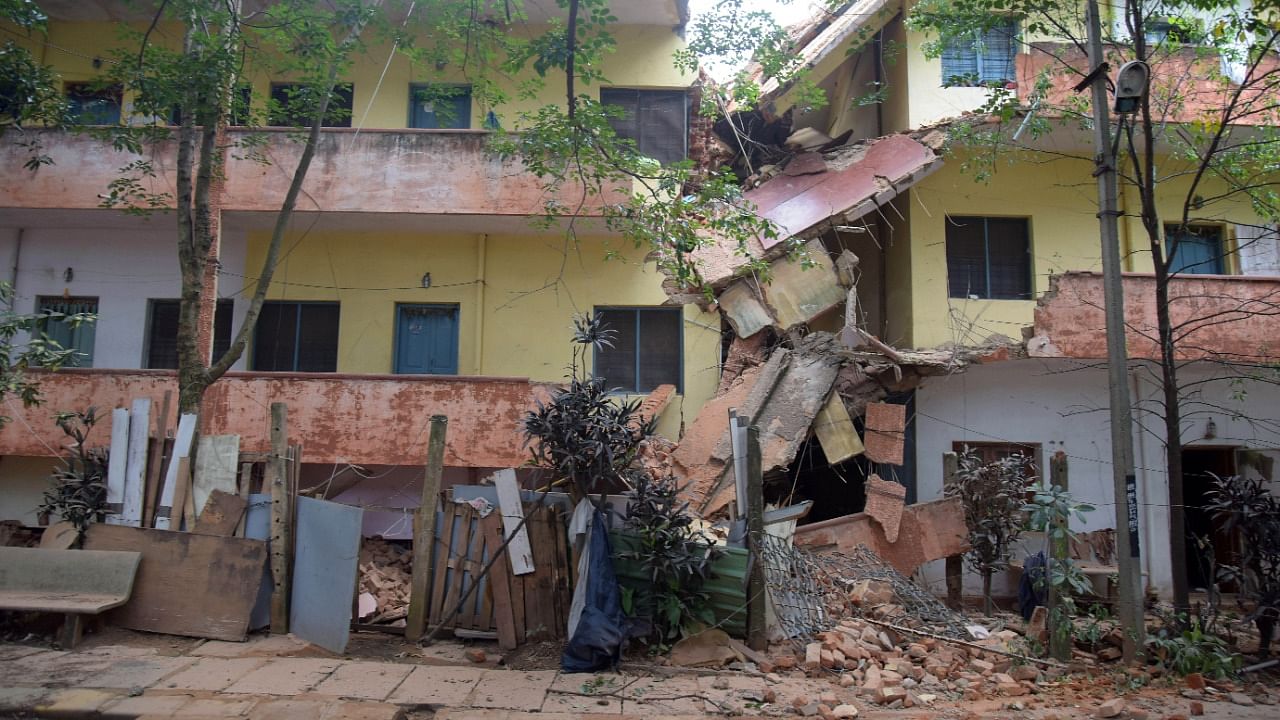 A part of staff quarters of Bangalore Milk Union Limited (BAMUL) collapsed at Dairy Circle in Bengaluru on Tuesday, September 28, 2021. Credit: DH Photo