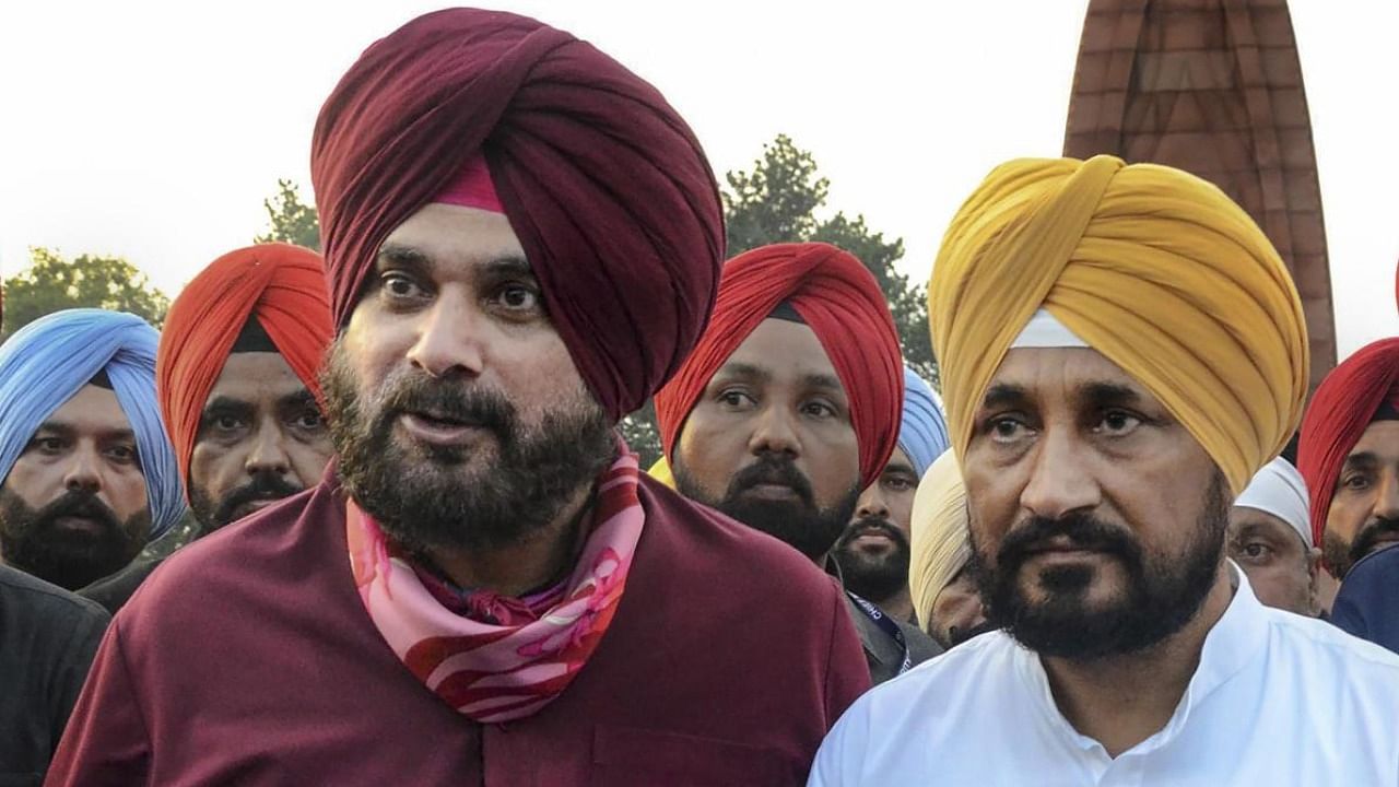 Navjot Singh Sidhu and newly-inducted CM Channi. Credit: PTI File Photo