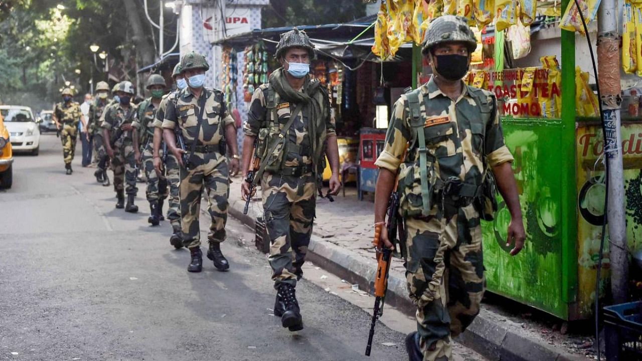 Paramilitary jawans conduct a route march for Bhabanipur Assembly by-election, in Kolkata. Credit: PTI Photo
