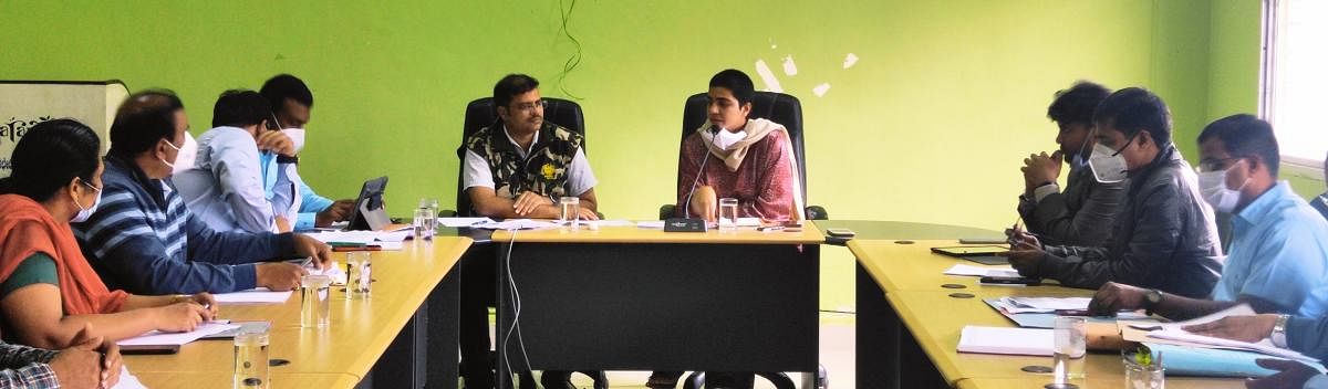 Deputy Commissioner Charulata Somal chairs the coordination committee meeting at Aranya Bhavan in Madikeri. Kodagu Circle CCF Takat Singh Ranaut looks on, among others. DH Photo