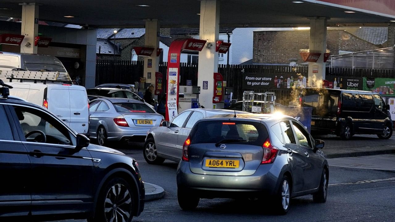 Drivers queue for fuel at a petrol station in London. Credit: AP Photo