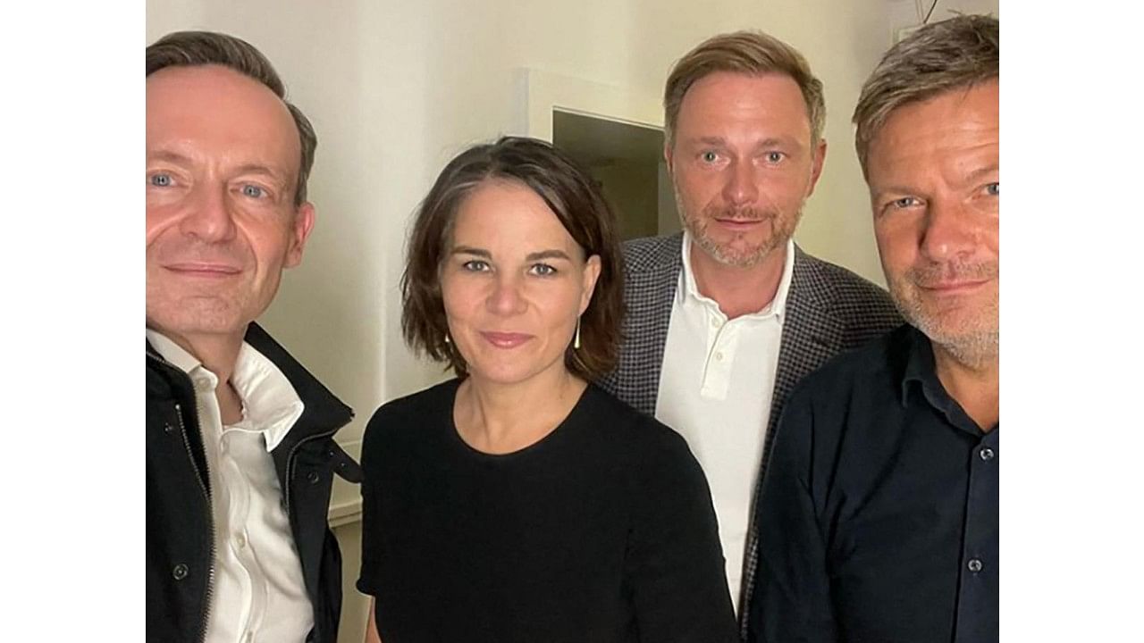 Greens leaders Robert Habeck and Annalena Baerbock with FDP leader Christian Lindner and General Secretary Volker Wissing. Credit: AFP Photo