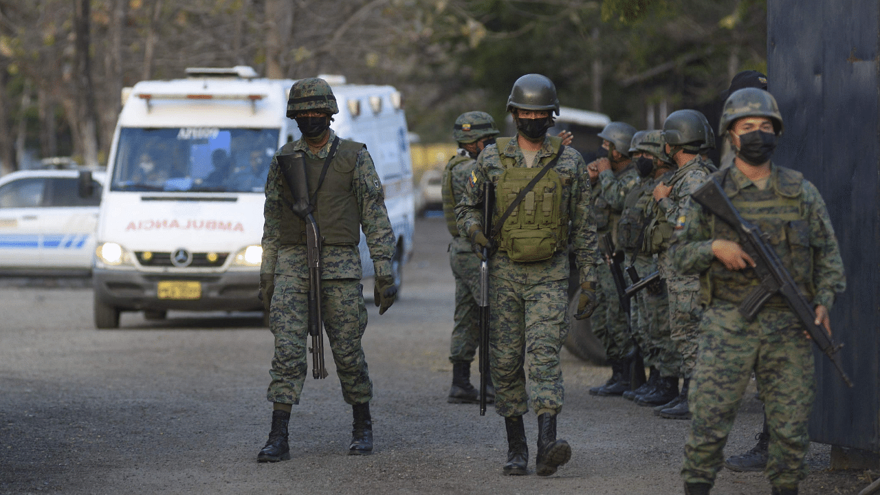 Members of the Colombian Army stand guard outside a prison in Guayaquil, Ecuador. Credit: AFP Photo