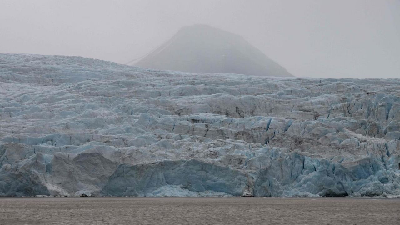 A view of Nordenskiold glacier melting and collapsing in the ocean, near Pyramiden, in Svalbard, a northern Norwegian archipelago. Credit: AFP Photo