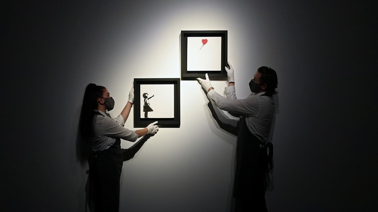 "Girl With Balloon" diptych by Banksy displayed ahead of upcoming auction at Christie's in London. Credit: Reuters Photo
