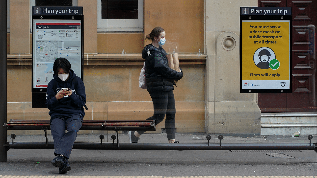 People wear protective face masks in the city centre during a lockdown to curb the spread of a coronavirus disease (Covid-19) outbreak in Sydney, Australia. Credit: Reuters Photo