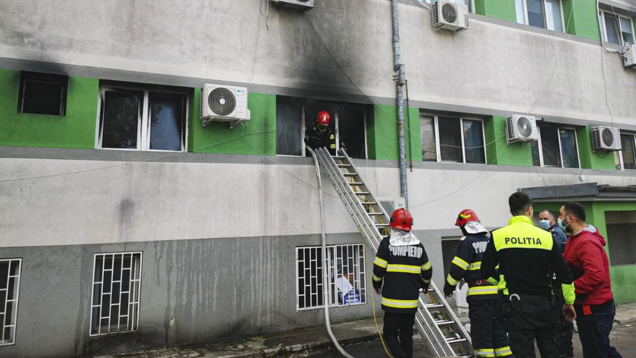 In this image released by Romania's Emergency Situations Inspectorate, firefighters put out a blaze at the COVID-19 ICU section of the Hospital for Infectious Diseases in the Black Sea port of Constanta, Romania. Credit: AP/PTI Photo