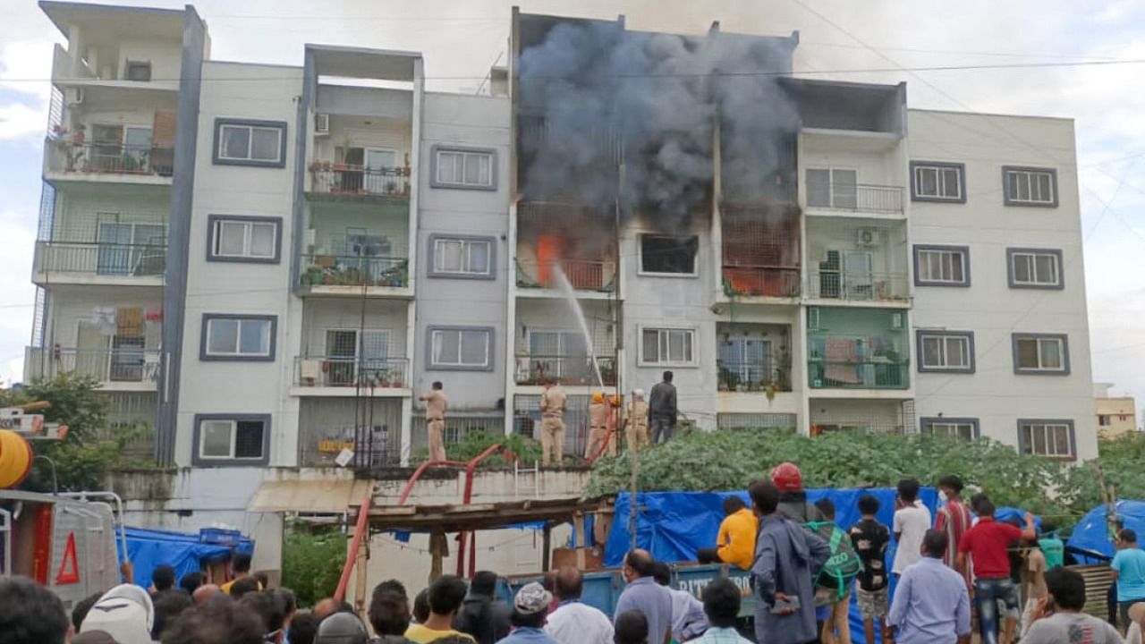 Fire force personnel could not get through a grille-covered balcony to rescue people trapped in a fire in the city recently. Credit: DH File Photo