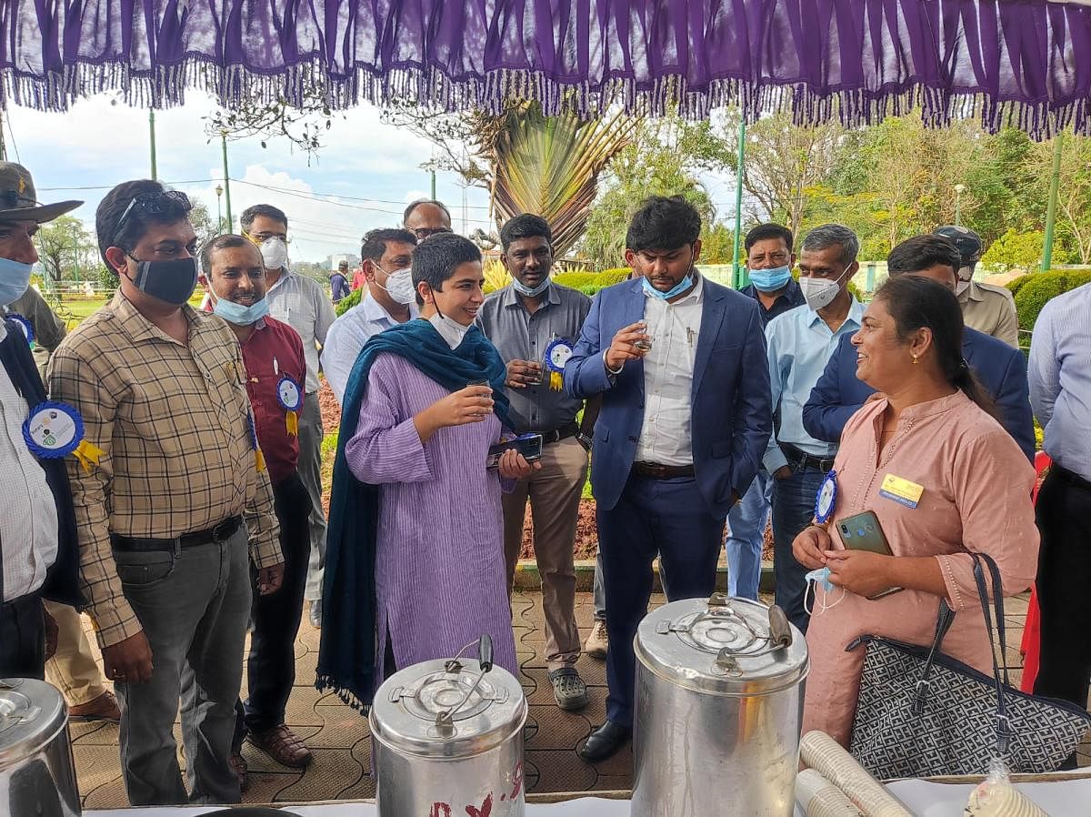 Deputy Commissioner Charulata Somal sips coffee at Raja Seat on Friday, on the occasion of International Coffee Day.