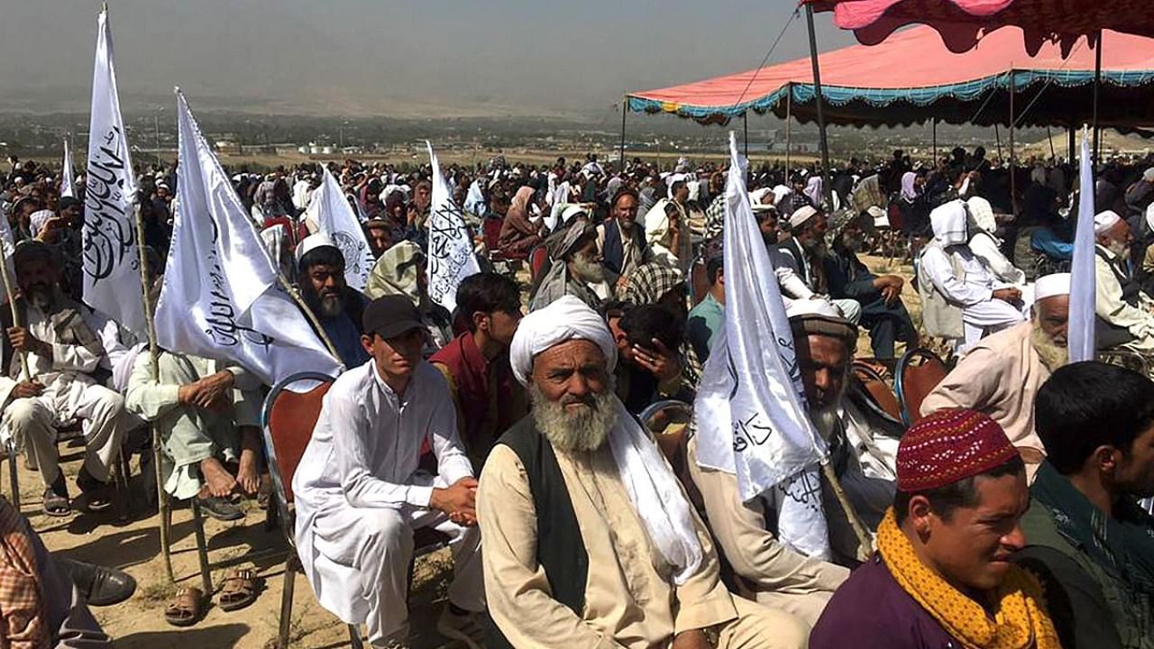 Taliban supporters attend an open air rally in a field in Kabul. Credit: AFP Photo