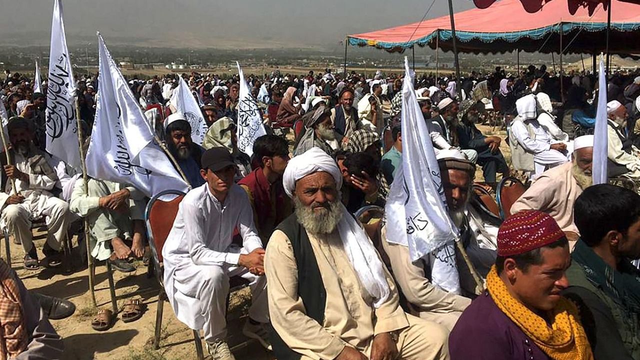 Taliban supporters attend an open air rally in a field in Kabul. Credit: AFP Photo