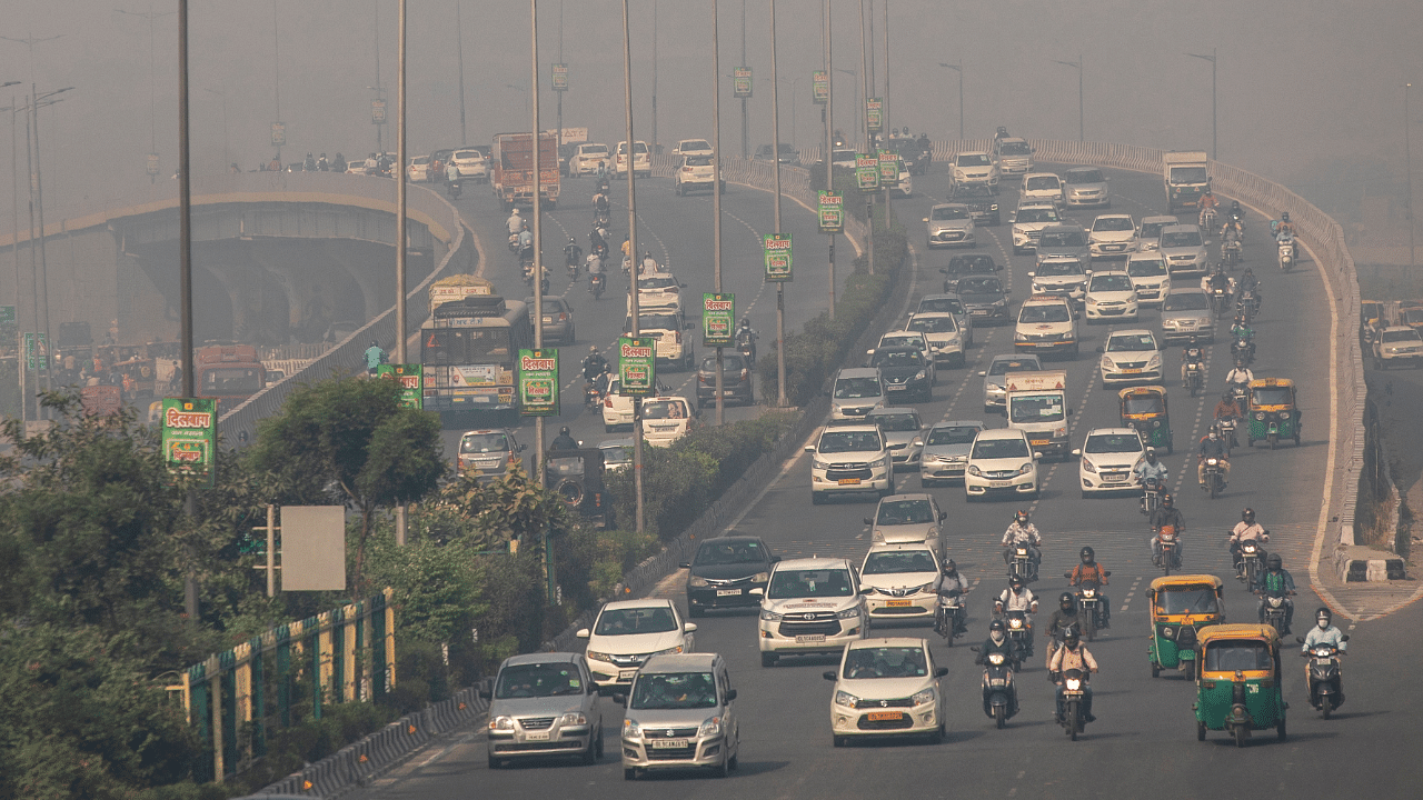Traffic moves on a smoggy morning in New Delhi. Credit: Reuters Photo