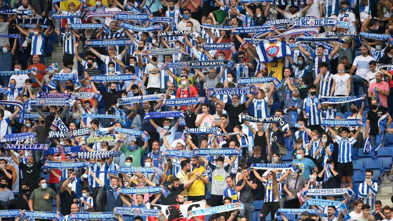 Espanyol's supporters cheer from the stands during the Spanish League football match between RCD Espanyol and Real Madrid CF at the RCDE Stadium in Cornella de Llobregat. Credit: AFP Photo