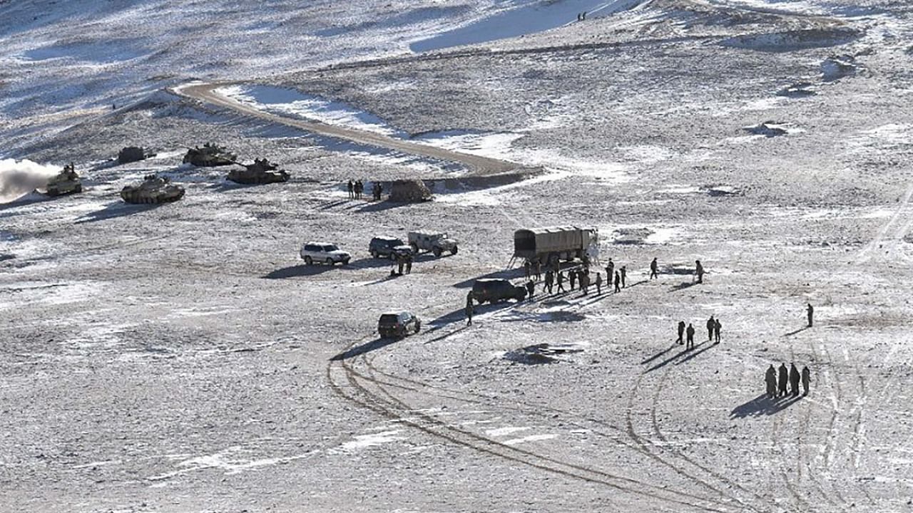 In this undated handout photograph released by the Indian Army on February 16, 2021 shows People Liberation Army (PLA) soldiers and tanks during military disengagement along the Line of Actual Control (LAC) at the India-China border in Ladakh. Credit: AFP Photo