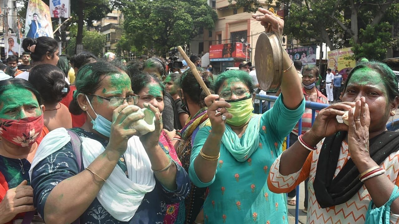 TMC supporters jubilate outside party supremo and West Bengal Chief Minister Mamata Banerjee's residence at Kalighat. Credit: PTI Photo