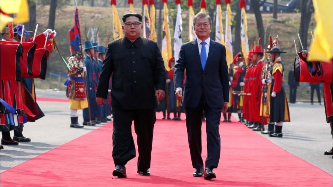 North Korea's leader Kim Jong Un (L) and South Korea's President Moon Jae-in (R). Credit: AFP File Photo