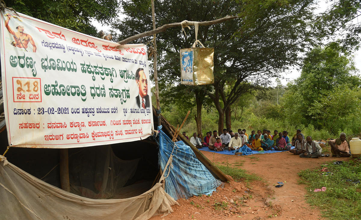 Tribal families stage protest demanding title deeds under the Forest Rights Act, 2006. Credit: DH Photo