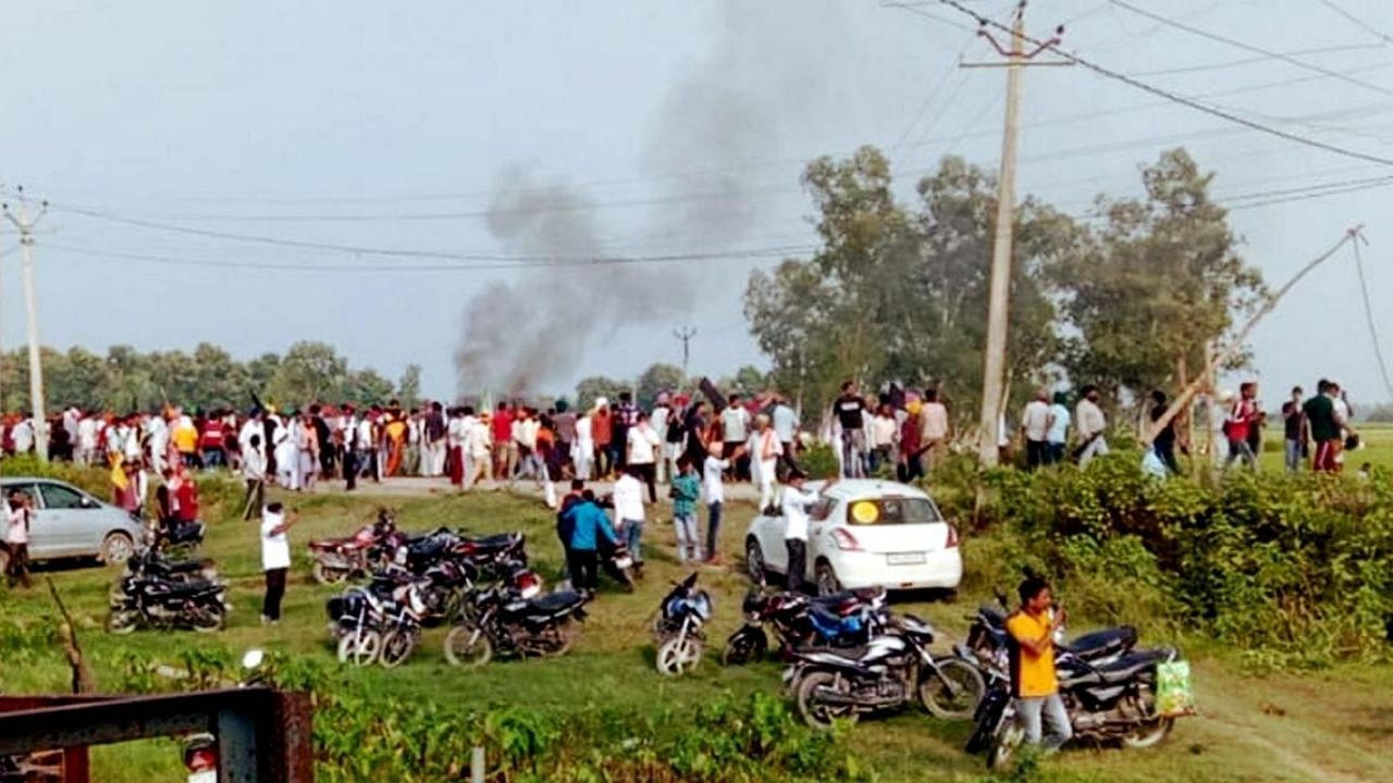 A vehicle set ablaze after violence broke out after farmers agitating were allegedly run over by a vehicle in the convoy of a union minister, in Lakhimpur Kheri. Credit: PTI Photo