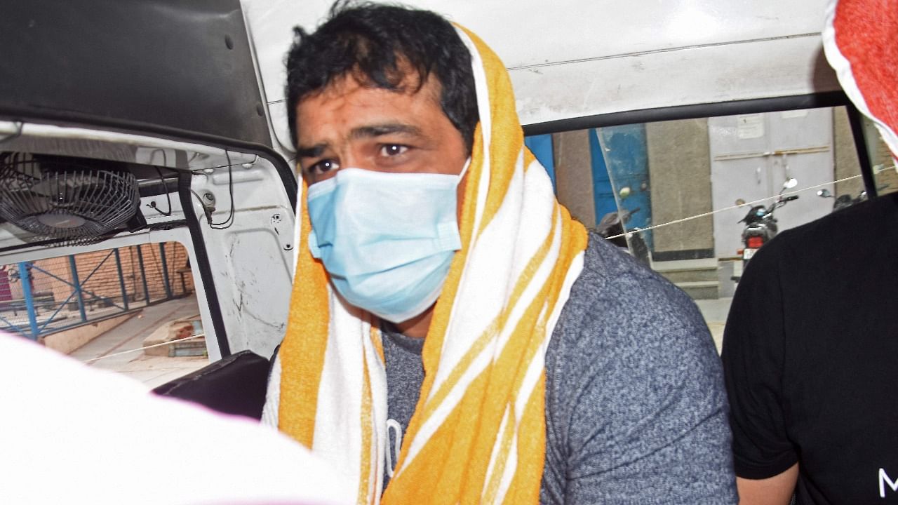 Sushil Kumar sits inside a vehicle after his arrest. Credit AFP Photo