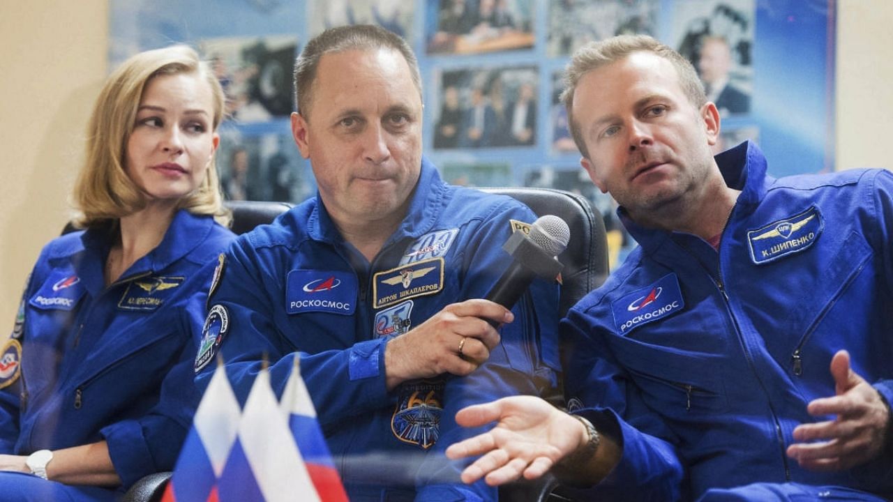 Actress Yulia Peresild (L), director Klim Shipenko (R), and cosmonaut Anton Shkaplerov, members of the prime crew of Soyuz MS-19 spaceship. Credit: AP Photo