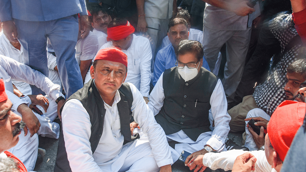 Samajwadi Party (SP) President Akhilesh Yadav along with party MP Prof Ram Gopal Yadav stage a protest, after he was not allowed by the police to go to Lakhimpur, in Lucknow, Monday, Oct. 4, 2021. Credit: PTI Photo